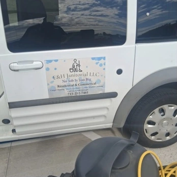 E and H Janitorial branded van with cleaning equipment