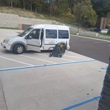 E and H Janitorial van parked at the work site
